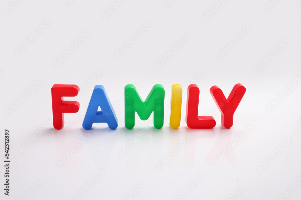 red green blue yellow plastic toy capital font letter alphabet family on white background copy text space concept red green blue yellow plastic toy capital font letter alphabet family on white background copy text space concept