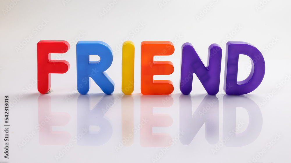 red green blue yellow plastic toy capital font letter alphabet friend on white background copy text space concept red green blue yellow plastic toy capital font letter alphabet friend on white background copy text space concept