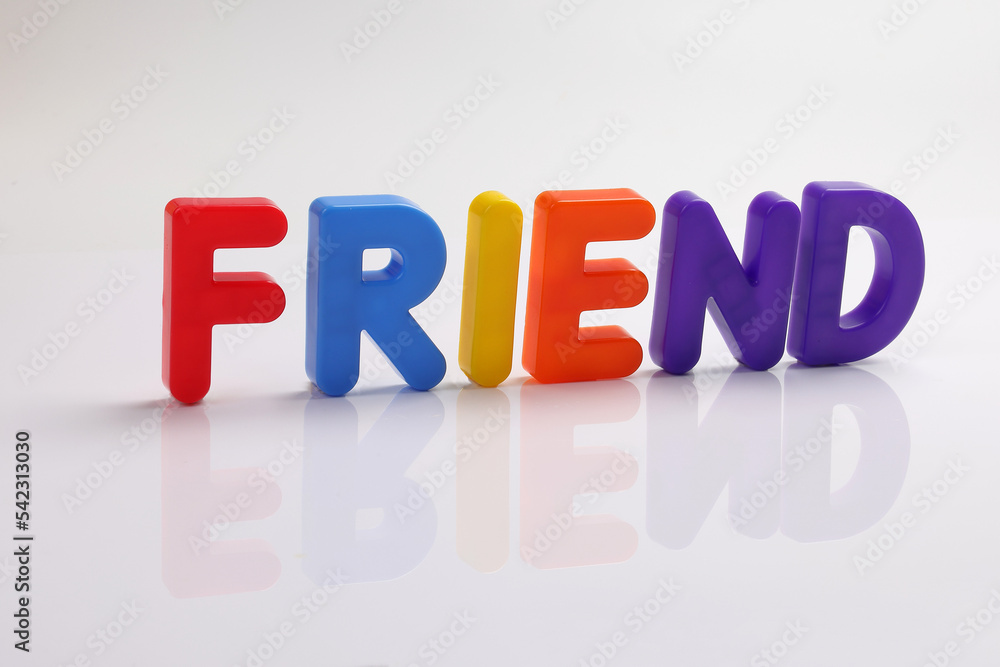 red green blue yellow plastic toy capital font letter alphabet friend on white background copy text space concept red green blue yellow plastic toy capital font letter alphabet friend on white background copy text space concept