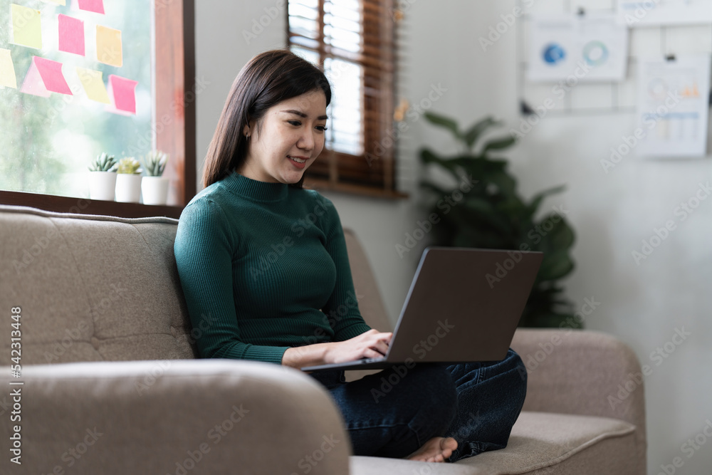 Portrait of asian beautiful young woman using laptop at home Portrait of asian beautiful young woman using laptop at home