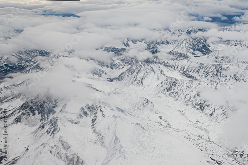Aerial view of snow covered Alaska mountains in winter © JT Fisherman