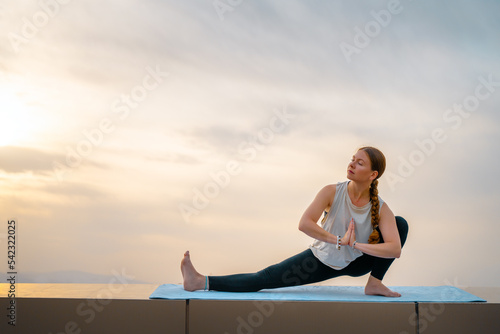 sportswoman is doing yoga
