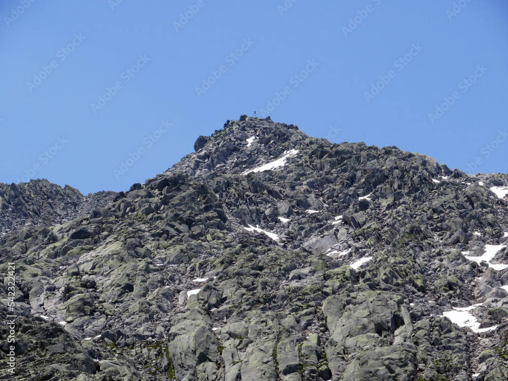 Rocky mountain peaks Poncione di Fieud (2696 m) and Fibbia (2738 m) in the massif of the Swiss Alps above the St. Gotthard Pass (Gotthardpass), Airolo - Canton of Ticino (Tessin), Switzerland (Schweiz Rocky mountain peaks Poncione di Fieud (2696 m) and Fibbia (2738 m) in the massif of the Swiss Alps above the St. Gotthard Pass (Gotthardpass), Airolo - Canton of Ticino (Tessin), Switzerland (Schweiz