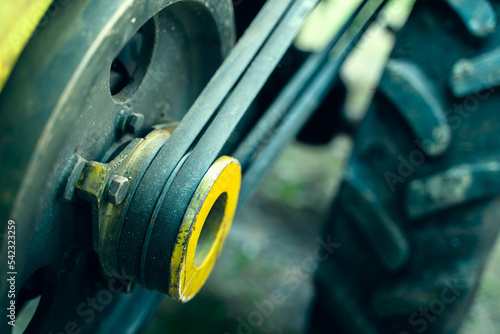 Walk-behind tractor pulley with two belts close-up. Tractor for agriculture, agricultural machinery photo