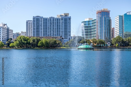 Skyline and high-rise buildings across Lake Eola in Orlando, USA © Jeannette Arocho/Wirestock Creators