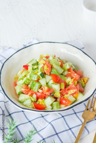 mediterranean salad in white bowl healthy food on table