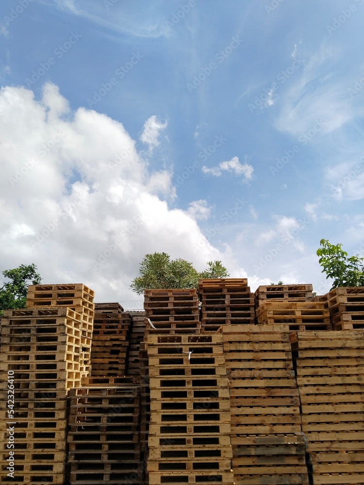 pile of wooden pallets. Wooden pallets have many uses, including for storing goods, stacking, and protecting goods that will be sent or moved by Forklift. pile of wooden pallets. Wooden pallets have many uses, including for storing goods, stacking, and protecting goods that will be sent or moved by Forklift.