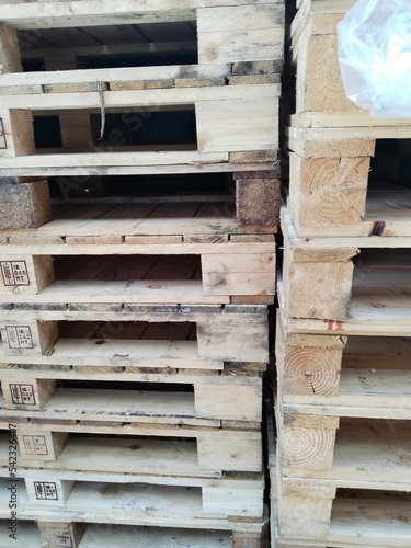 pile of wooden pallets. Wooden pallets have many uses  including for storing goods  stacking  and protecting goods that will be sent or moved by Forklift.