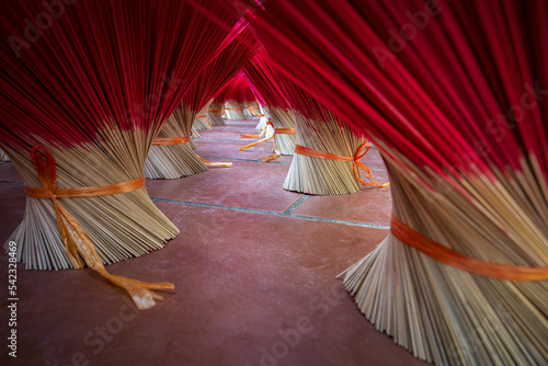 Close up picture of the base of bundle of incense sticks that are expand for drying outdoor in Vietnam.