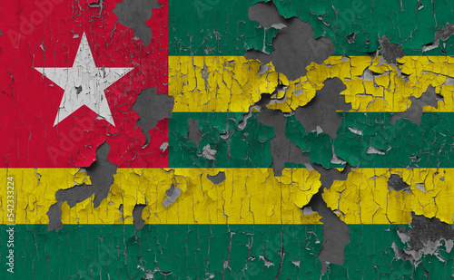 3D Flag of Togo on an old stone wall background.