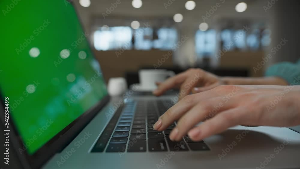 Executive arms pushing buttons at green screen computer. Woman typing laptop Executive arms pushing buttons at green screen computer. Woman typing laptop
