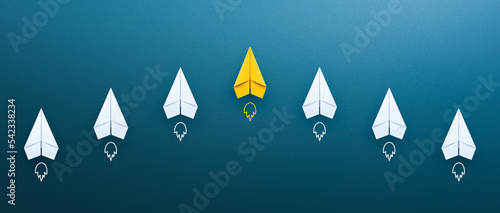 Business competition and Leadership concept with Yellow paper plane leading among a white paper planes