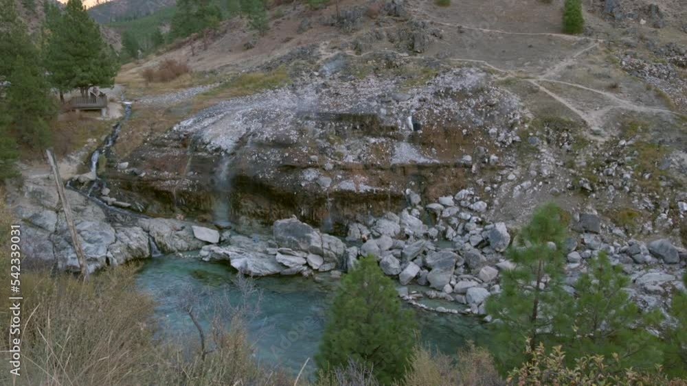 Kirkham Hot Springs are natural hot spring thermal pool set in Idaho as seen from across the river Kirkham Hot Springs are natural hot spring thermal pool set in Idaho as seen from across the river