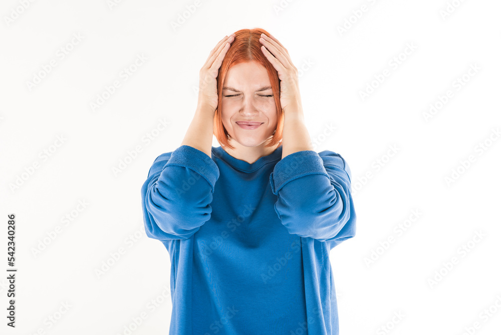 The girl is suffering from headaches and migraines on a white background. The girl is suffering from headaches and migraines on a white background.