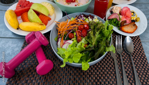 Healthy food as life balance of workout on the table background