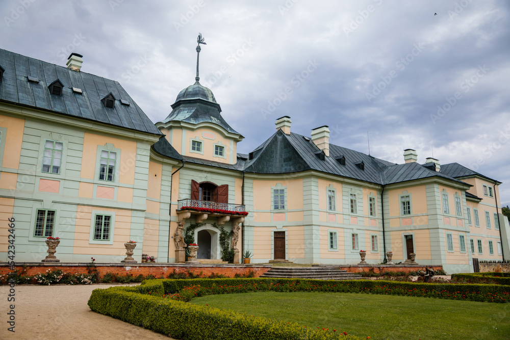 Manetin, West Bohemia, Czech Republic, 23 July 2022: Baroque mansion, castle or chateau with garden at summer day, romantic atmosphere, Classical style ancient aristocratic residence with park
