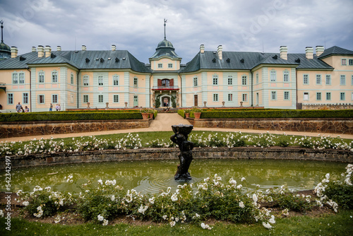 Manetin, West Bohemia, Czech Republic, 23 July 2022: Baroque mansion, castle or chateau with garden at summer day, romantic atmosphere, Classical style ancient aristocratic residence with park photo