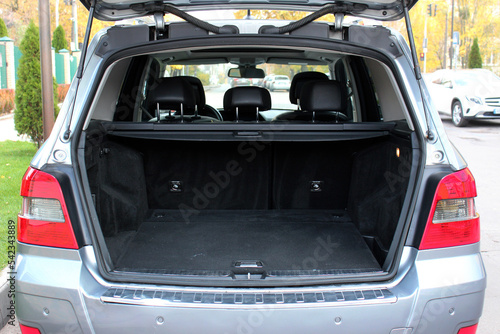 Wallpaper Mural Open back door modern SUV. Clean, open empty trunk in the grey car. Rear view of the car open trunk. Opened empty car trunk. Torontodigital.ca
