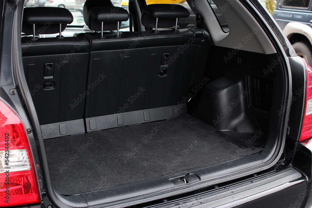 SUV Trunk. Modern car SUV with open empty trunk. Modern wagon car open trunk. Car boot is open. SUV Trunk. Modern car SUV with open empty trunk. Modern wagon car open trunk. Car boot is open.
