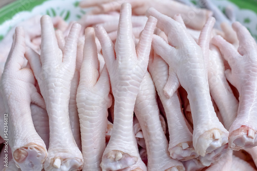 Many chicken feet pile close up thai food background