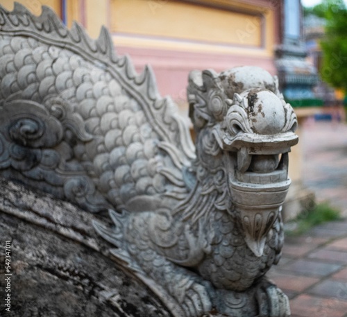 Statue of a dragon in e Thuy Tien Lake abandoned water park © Toby Marshman/Wirestock Creators
