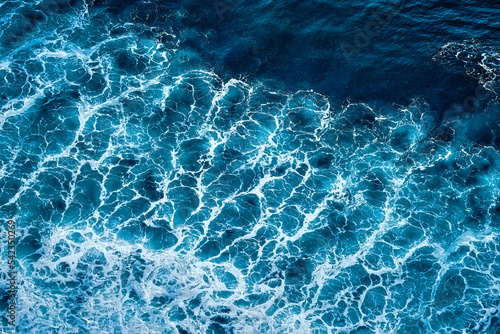 Aerial view to seething waves with foam. Waves of the sea meet each other during high tide and low tide © Dmitry Yakovtsev