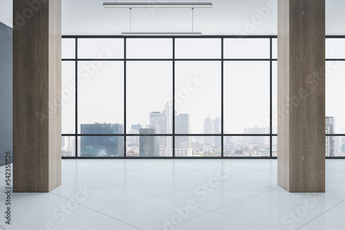 Luxury spacious concrete and wooden museum interior with panoramic windows and city view. 3D Rendering. photo