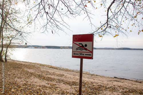 Fototapeta Naklejka Na Ścianę i Meble -  Sign swimming is forbidden on the beach