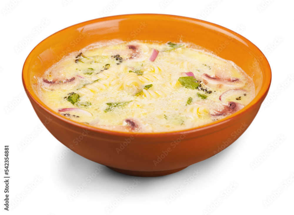 Creamy soup in orange bowl isolated on white Creamy soup in orange bowl isolated on white