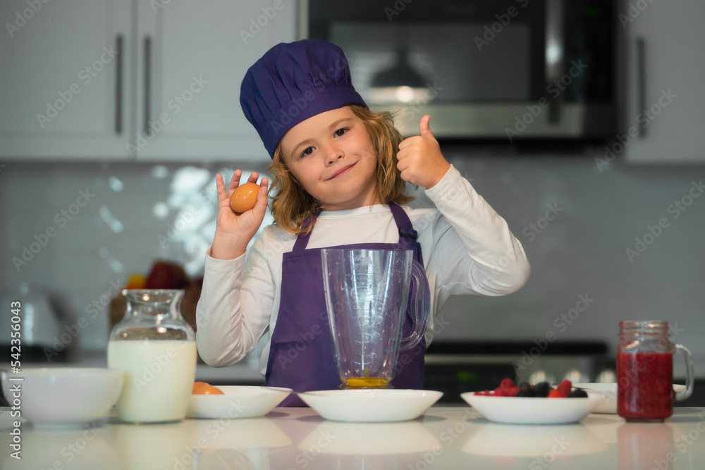Chef child cooking. Child making tasty delicious. little boy in chef hat and an apron cooking in the kitchen. Kid boy in chef hat and an apron cooking in the kitchen. Chef child cooking. Child making tasty delicious. little boy in chef hat and an apron cooking in the kitchen. Kid boy in chef hat and an apron cooking in the kitchen.