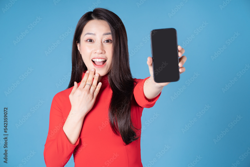 Photo of young Vietnamese woman wearing red ao dai Photo of young Vietnamese woman wearing red ao dai