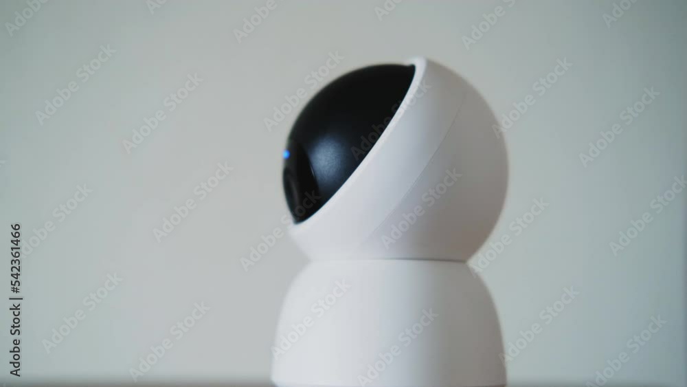 Home surveillance online camera, close-up on a white background Home surveillance online camera, close-up on a white background