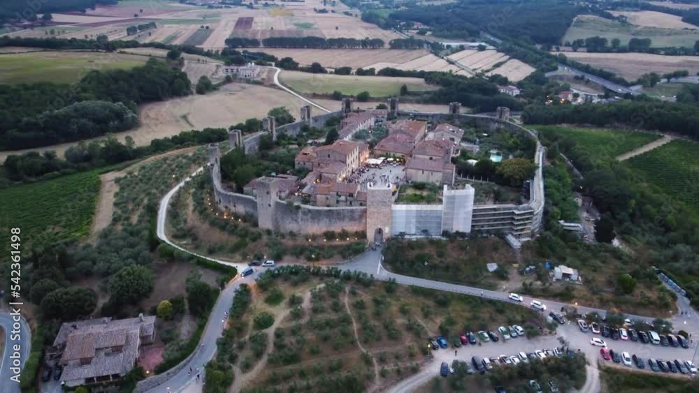 Drone flight in Monteriggioni, Tuscany, Sunset drone flight over the medieval village with views of the famous city walls Drone flight in Monteriggioni, Tuscany, Sunset drone flight over the medieval village with views of the famous city walls