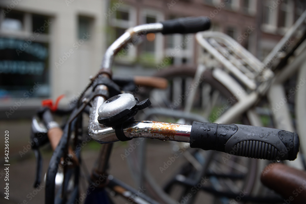 Close up details of a wet bike after rain, raindrop aesthetics. Amsterdam Close up details of a wet bike after rain, raindrop aesthetics. Amsterdam