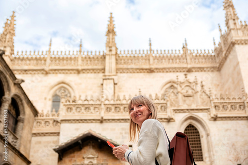 Tourism in Granada.Beautiful girl visiting Cathedral. Holidays in Spain. © Renata Hamuda