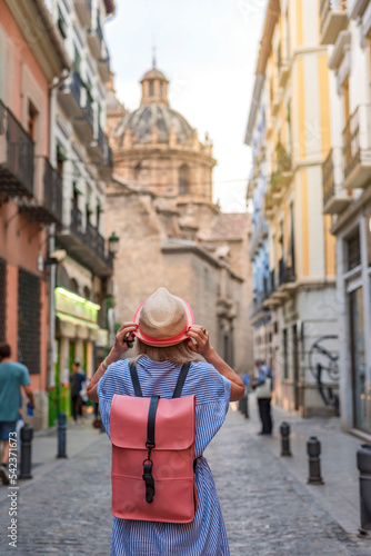 Woman tourist walking in old town of Granada Spain, travel concept. Travel alone