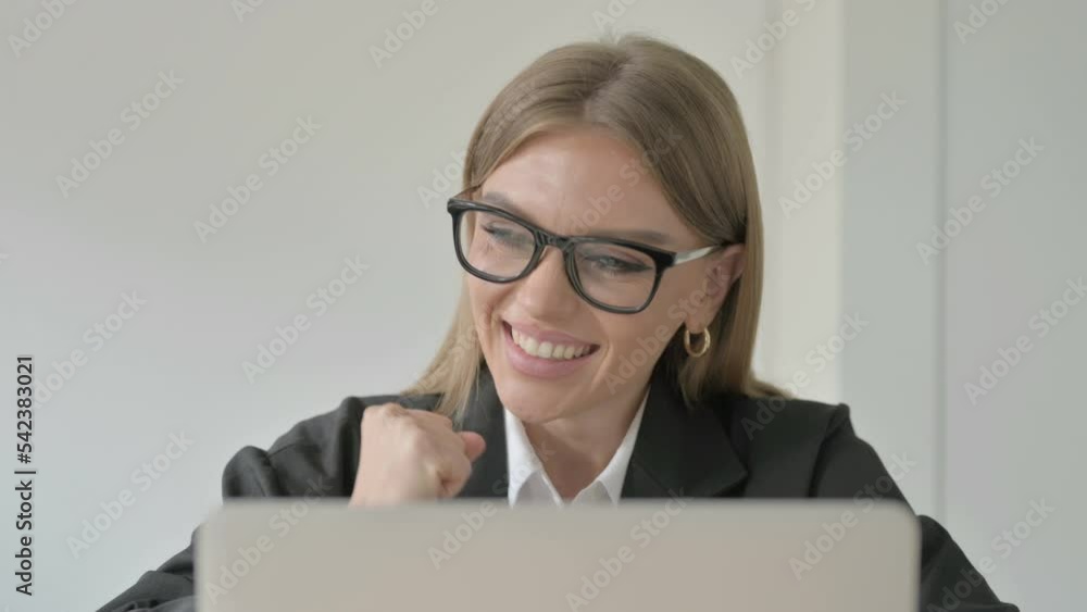 Close Up of Young Businesswoman Celebrating Success on Laptop Close Up of Young Businesswoman Celebrating Success on Laptop
