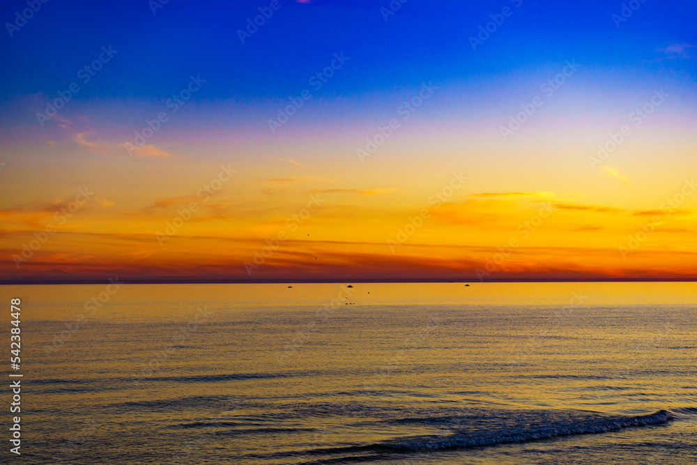 Fototapeta premium Sky at sunset over sea