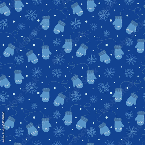 Seamless pattern with warm winter mittens and snowflakes on a blue background. Christmas print. Colorful vector illustration hand drawn. Packaging or fabric, card or cover