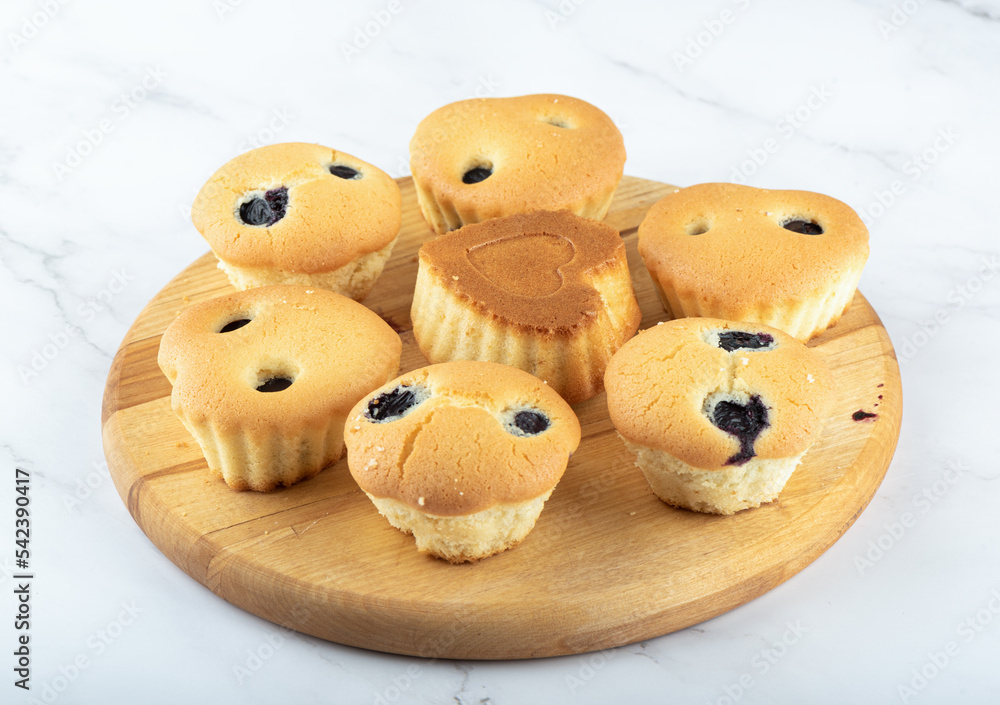 Freshly baked cupcakes filled with blueberries. Close up. Freshly baked cupcakes filled with blueberries. Close up.