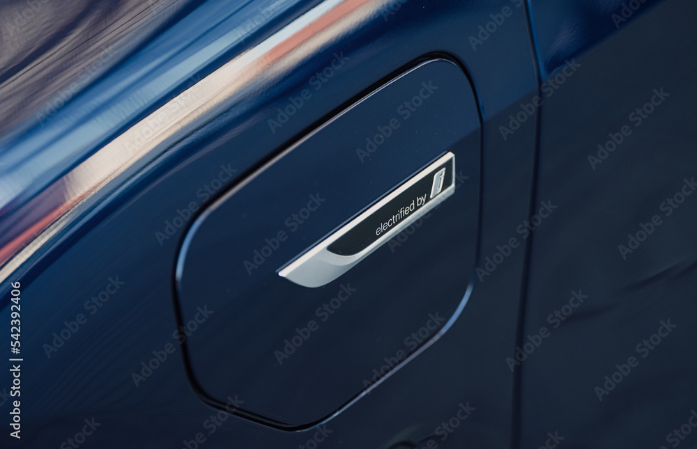 The logo sign of electrified by BMW i placed on a plugin hybrid X5 SUV ...
