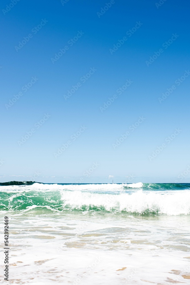 waves crashing on the beach in australia