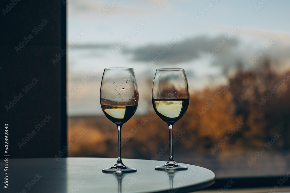 Two glasses against the background of an autumn landscape Two glasses against the background of an autumn landscape