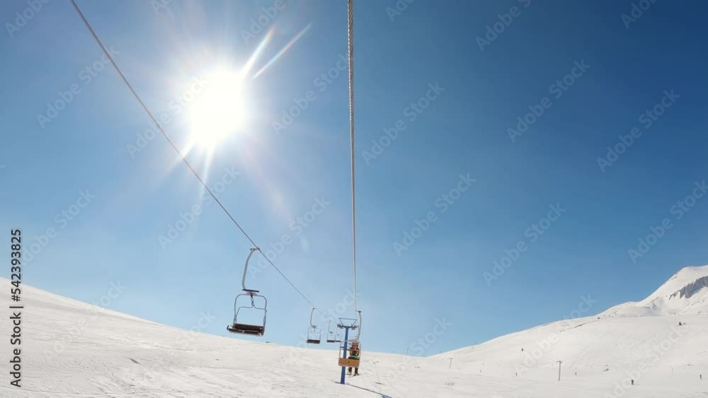 Skier on a ski lift pov Skier on a ski lift pov