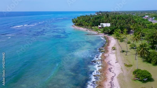 Aerial shot of beautiful beach Guayacanes of the Dominican Republic. blue sea. photo