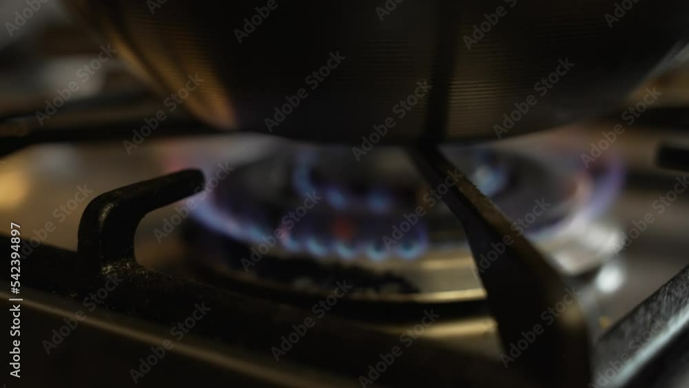 Bokeh Background View Blue Gas Flame Under Pot On Cooker. Close Up, Slow Motion
