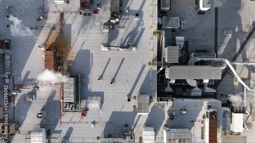 Energy efficiency building. Rooftop HVAC units on factory plant. Top down aerial of manufacturing plant. photo