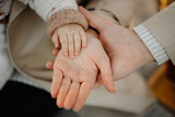 close up of hands holding hands, family concept