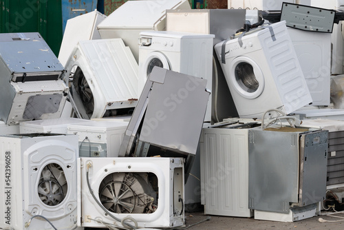 A pile of used household appliances, close-up. Environmental problem, electronics recycling
