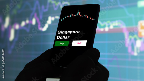 Photography An investor's analyzing the Singapore Dollar etf fund on screen